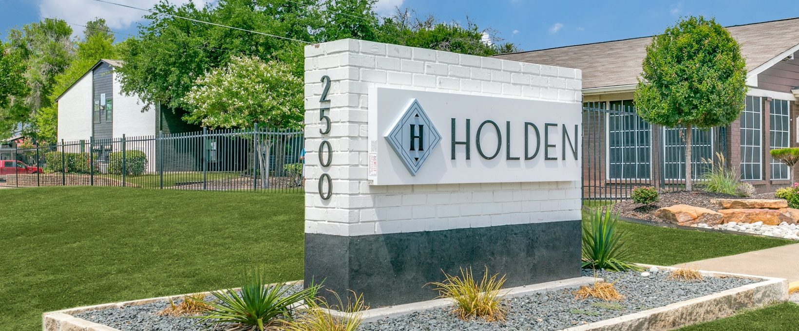 the sign for holden apartments in austin, texas at The  Holden